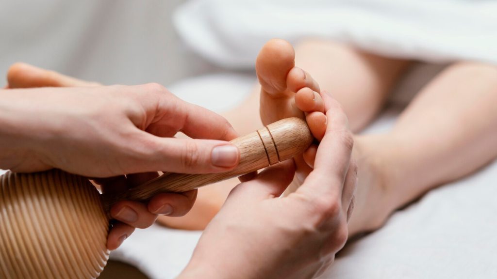 close up therapist using wooden tool 23 2148882177